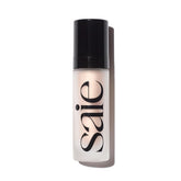 Saie Glowy Super Gel bottle pump shows a dewy primer for radiant skin.