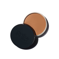 Saie Sun Melt packaging closeup shows buildable bronze for natural warmth.