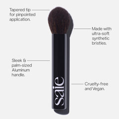Saie The Fluffy Brush palm-size handle supports travel-ready makeup routines.