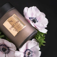 SAINT JANE Deep Sleep Bath Salts being poured into a warm bath for muscle relaxation.
