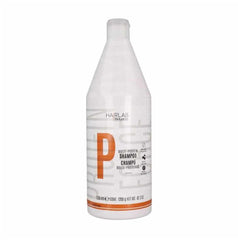 Salerm Hairlab Shampoo bottle pouring fortifying formula for damaged hair.