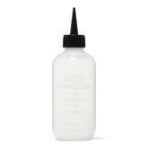 Salon Care Narrow Tip Applicator Bottle shown with soft plastic for easy squeezing and control