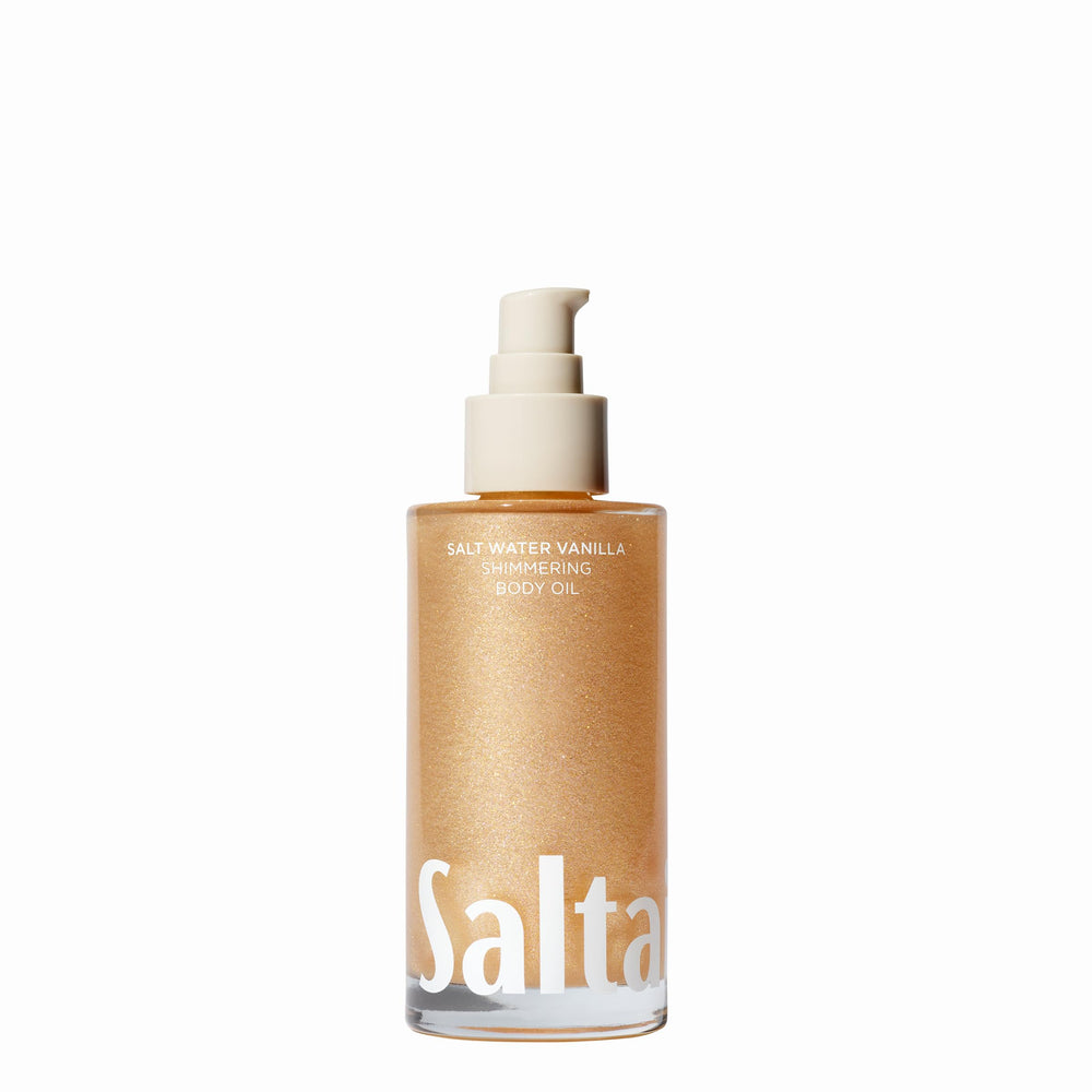Saltair Shimmering Body Oil bottle pour shows sun-kissed glow for all skin types.