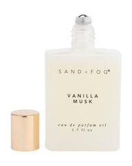 Sand + Fog Vanilla Musk rollerball applied to pulse point for intimate, long-lasting scent