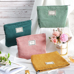 Sanwuta corduroy makeup bag open top enables easy access.