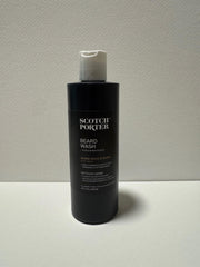 Applying Scotch Porter Beard Wash in the shower for hydrated facial hair.