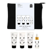 SEEN Curly On The Go Kit shampoo bottle illustrates frizz control for travel curls.