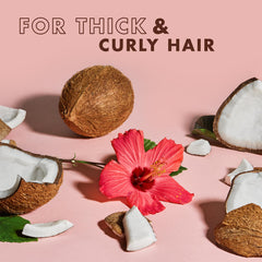 Conditioner application highlights slip and defined, frizz-resistant curls.