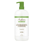 SheaMoisture Coconut Oil Moisture Boosting Conditioner bottle pour provides hydrated hair.