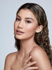 SHEGLAM cream highlighter stick application on the face for seamless glow