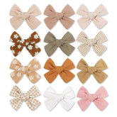 Shelbybox baby girl hair clips 12-pack fashion bows add versatile styling.