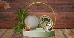 Shiner Gold Clay Pomade in-hand styling shot for flexible, controlled shaping.