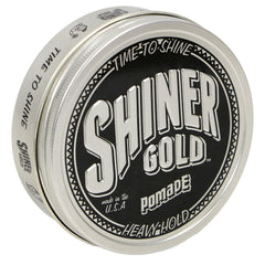 Shiner Gold Pomade bottle pour highlighting strong hold for sleek styles.