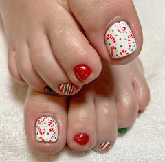SHUXILIN Christmas candy cane toenails closeup for festive holiday style.