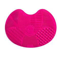 Sigma Beauty brush cleaner mat pink front view, compact travel-friendly solution for brushes.