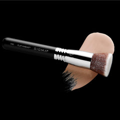Sigma Beauty F85 in hand demonstrating precise buffing for an even finish.
