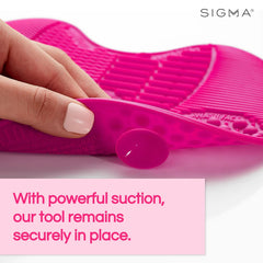 Sigma Beauty travel-friendly brush cleaner mat pink compact design fits conveniently in a makeup kit.