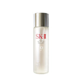 SK-II Facial Treatment Essence bottle being poured for hydrating skin prep.