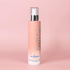 Silk'e Hair Detangler Spray during brushing for reduced pull and frizz control