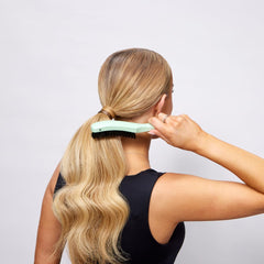 Smooth Stick Mane Master curved brush bristles close-up showing gentle detangling.
