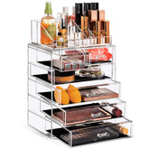 Sorbus acrylic makeup organizer seven-compartment vanity stores brushes, lipsticks, and jewelry for easy access.