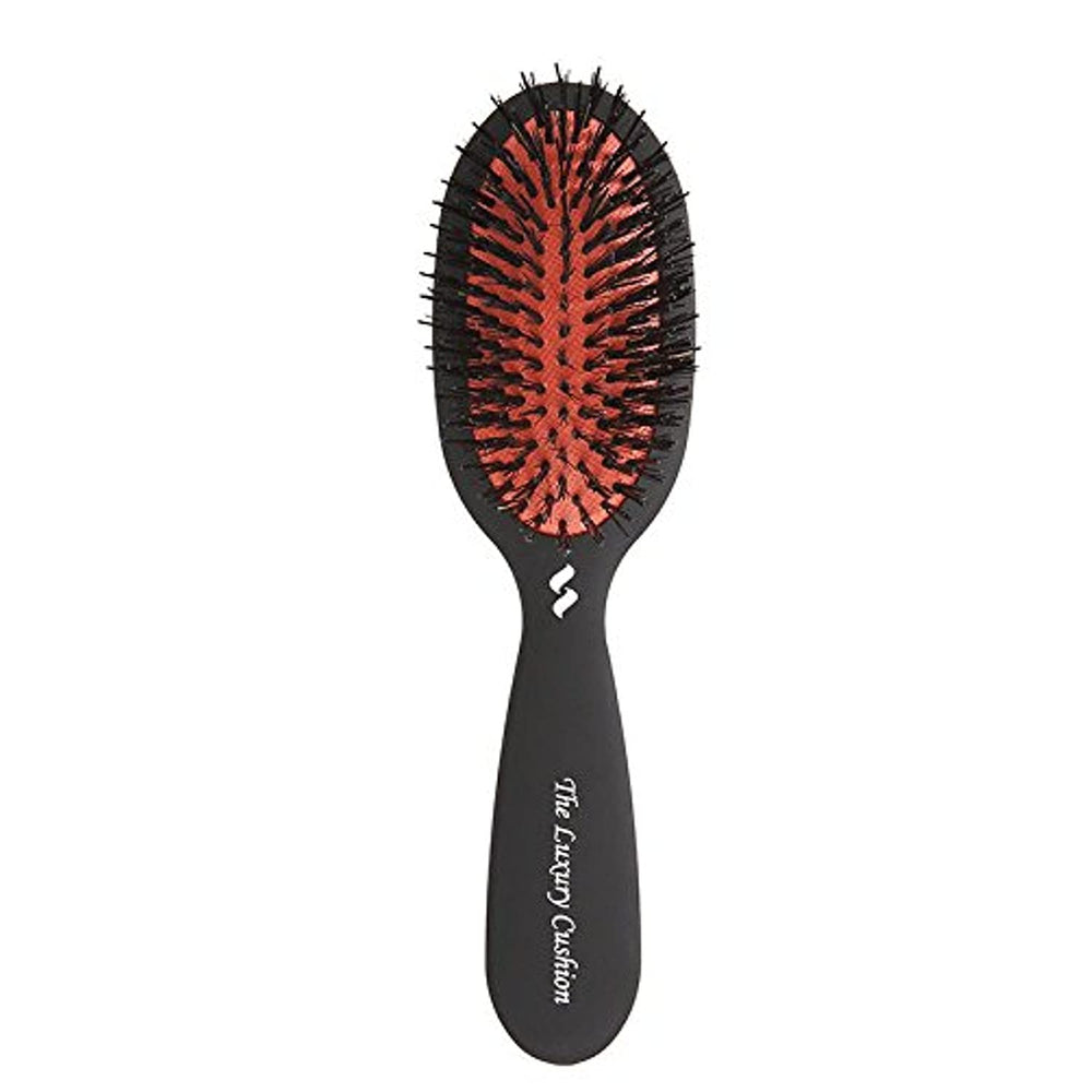 Spornette small luxury cushion brush close-up for travel-friendly styling and smoothing.