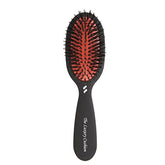 Spornette small luxury cushion brush close-up for travel-friendly styling and smoothing.