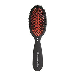 Spornette small luxury cushion brush close-up for travel-friendly styling and smoothing.