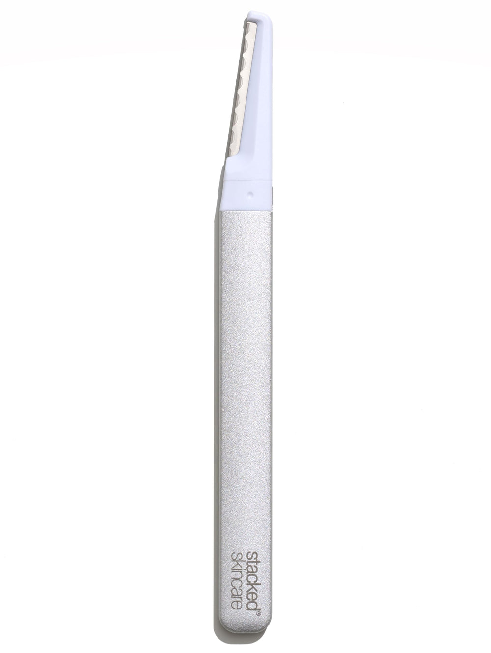 StackedSkincare dermaplaning tool with metal handle for precise at-home exfoliation.