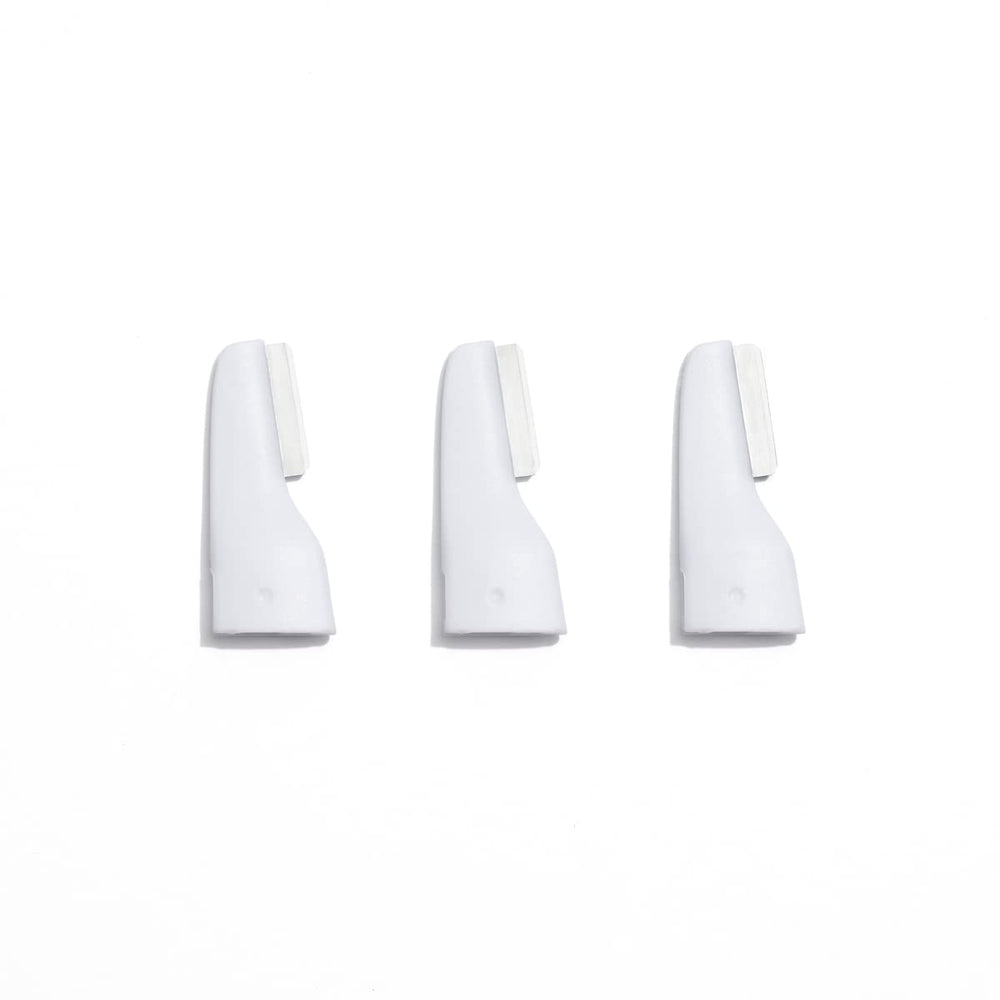 StackedSkincare replacement blades 3-pack closeup for at-home peach fuzz removal and exfoliation.