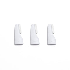 StackedSkincare replacement blades 3-pack closeup for at-home peach fuzz removal and exfoliation.