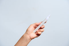 StackedSkincare travel-ready dermaplaning blades in travel case for on-the-go exfoliation.