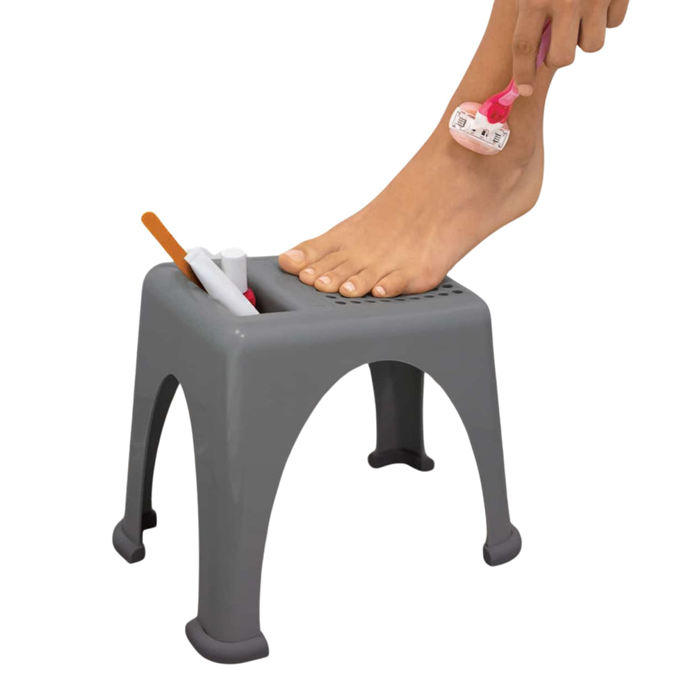 Step Up Easy Reach Foot Rest in shower with non-slip surface for safer shaving.