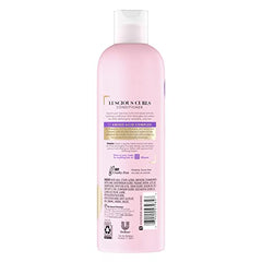 Suave Luscious Curls Conditioner curls-definition close-up for smoother, defined curls.