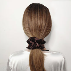 Sufermoe soft elastic satin scrunchie close-up highlighting smooth hold.