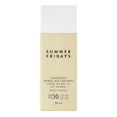 Summer Fridays ShadeDrops SPF 30 mineral milk bottle pour demonstrates easy, lightweight sun protection.