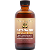 Sunny Isle Batana Oil bottle pour for easy scalp nourishment.