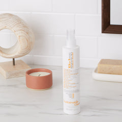 Sustainable Glam Epic spray applied to hair for quick detangling and styling