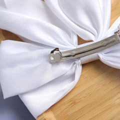 SUSULU large satin bow hair accessory enhances updos and party looks.