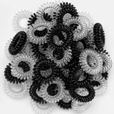 TailaiMei spiral hair ties close-up, black and transparent, gentle non-damaging hold.
