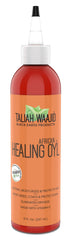 Taliah Waajid African Healing Oyl hands applying demonstrates multi-use moisture.