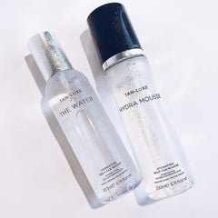 TAN-LUXE Hydra Mousse tanning-mitt used for even circular motion.