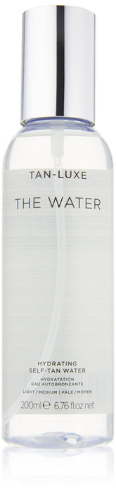 Tan-Luxe The Water mist application shows easy, mess-free coverage for hydrated glow.