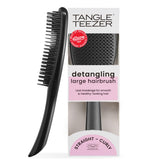 Tangle Teezer Large Ultimate Detangler black gloss paddle eases long-hair detangling.