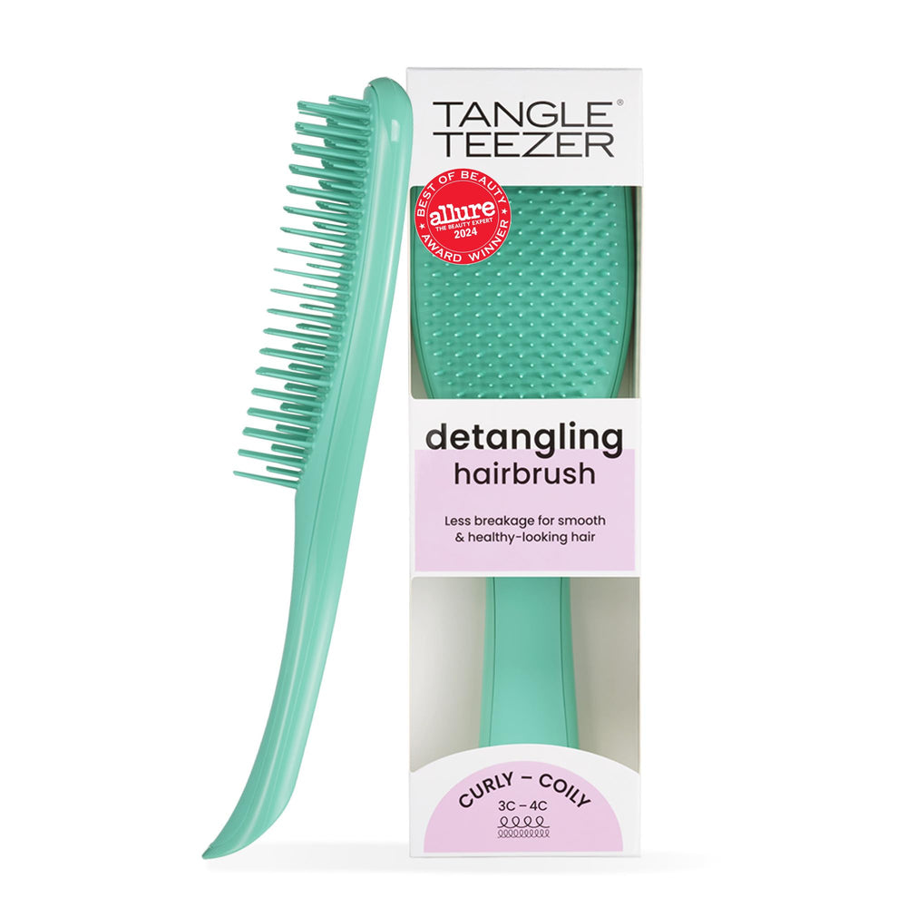 Tangle Teezer Ultimate Detangler aqua green held for comfortable detangling grip