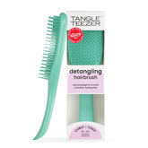 Tangle Teezer Ultimate Detangler aqua green held for comfortable detangling grip