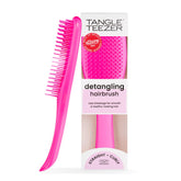 Tangle Teezer Ultimate Detangler pink closeup showing gentle knot-free detangling on tangled hair.