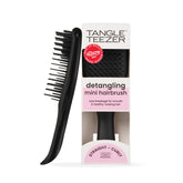 Tangle Teezer Ultimate Detangler close-up shows regular-flex teeth for knot-free detangling across hair types.