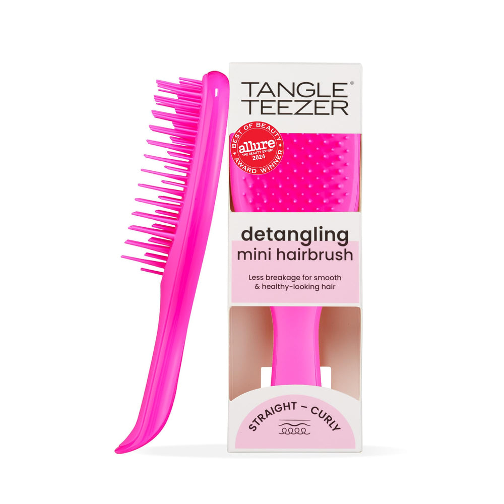 Tangle Teezer Ultimate Detangler Runway Pink hairbrush in hand for quick knot-free styling.