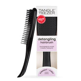 Tangle Teezer Ultimate Detangler on wet hair for gentle knot removal and smooth results.